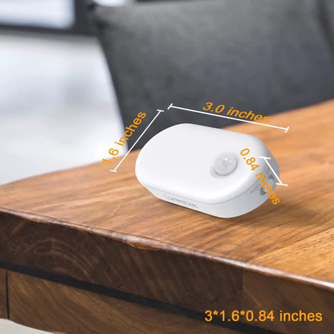 Amber 1800K Plug In Motion Sensor Night Light With Stepless Dimmable LED Always On Or Auto Off 120 Lumen on a table