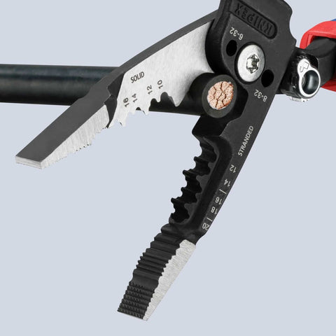 Close-up of Knipex Forged Wire Stripper 13 72 8 8 Inch cutting solid copper wire, showing shear blades and measurements.