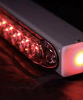 Close-up of Advantage Wireless Tow Light Bar 22 Inch LED Magnetic Trailer Light Kit with glowing red LEDs