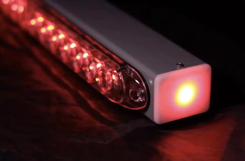 Close-up of Advantage Wireless Tow Light Bar 22 Inch LED Magnetic Trailer Light Kit with glowing red LEDs