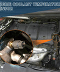 Coolant temperature sensor installed in engine bay; gray plastic connector on metal housing