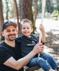 Heavy Duty Wooden Zip Line Seat For Backyard Adventures, Pine Wood Frame Holds Up To 350 Lbs, Soft White Rope With Easy Knot Adjustments, Seat Only, Made In USA, Built Tough For Safe Fun Rides with happy child sitting on it.