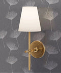 Gray Dandelion Silver Metallic Wallpaper Featuring Fibrous Texture And Eco Friendly PVC Free Finish Super Slick Paste The Wall Application For Totally Legit Chic Vibes with gold sconce lamp.