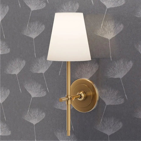 Gray Dandelion Silver Metallic Wallpaper Featuring Fibrous Texture And Eco Friendly PVC Free Finish Super Slick Paste The Wall Application For Totally Legit Chic Vibes with gold sconce lamp.
