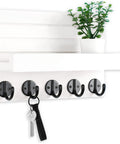 Solid Paulownia Wood Wall Mounted Key And Mail Holder Shelf With Heavy Duty Hooks For Coats Bags And Keys showing hooks and shelf with plant.