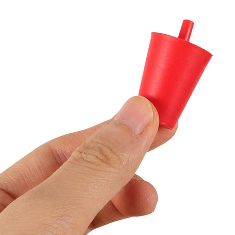 Hand holding red conical silicone plug from Top 60 Silicone Plugs Kit For High Heat Resistant Conical Hole Covers Perfect Spray Paint Masking Tools With Easy Use Design To Keep Coating Protected And Surfaces Spotless Like Boss.