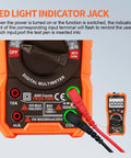 Close-up of Digital Multimeter For DIYers And Pros True RMS 10A 1000V 6000 Counts with LED jack indicator and test probes.