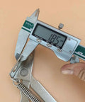 Measuring a 2 Pieces 80 Degree Foldable Lifting Bracket Black Spring Hinge with caliper showing dimensions for sofa lifts.
