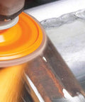 Enduro-Flex Turbo Abrasive Flap Disc Pack Of 10 36/60 Grit 5 Inch Grinding Disc in use on metal surface for deburring edges