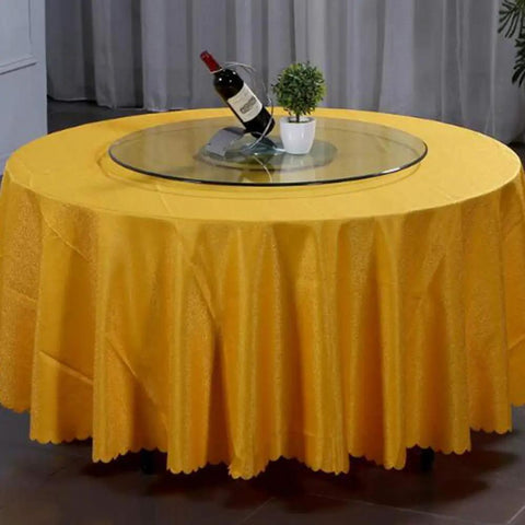 Must Have Glass Lazy Susan Turntable For Dining And Kitchen on yellow table with wine and plant