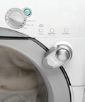 Safety 1st Prograde front-loading washer/dryer lock on white machine; circular metal latch with Hold to Start button.