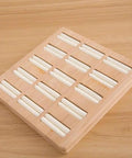 Straight Up The Coolest Wooden Ring Storage Tray With 15 Grids And Soft Velvet Lining To Keep Your Bling Organized On Vanity Or Dresser For Earrings And Bracelets, viewed from above.