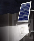 Spot Lighting Led Solar Flood Lights Outdoor, 272 LEDs 120W 8000 Lumen, mounted with solar panel, illuminating dark area.