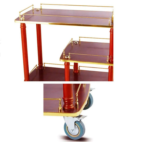 Solid As A Rock Three Tier Serving Cart Heavy Duty Kitchen Utility Trolley With Stainless Steel Accents close-up of wheels and gold trim.
