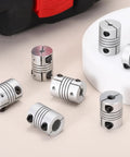Two Pack Flexible Shaft Couplers 4 To 6.35mm Bore 20mm Long 15mm Diameter Aluminum Alloy Joint Connector For Stepper Motors Ideal For 3D Printers CNC Machines DIY Encoders And Transmission Projects, silver couplers on display