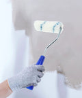 Pro Grade Paint Roller Kit With Solid Frame And Click Swap Sleeves For Flawless Wall Painting and Crisp Edging in use on a wall.