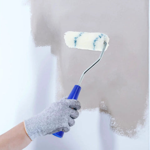 Pro Grade Paint Roller Kit With Solid Frame And Click Swap Sleeves For Flawless Wall Painting and Crisp Edging in use on a wall.