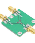 Real Deal Two Way RF Power Splitter Module And Signal Dividing PCB Board Offering Six Decibel Attenuation With Straight Up Reliable DC To Five Gigahertz Operation Period, showing SMA connectors and green PCB.