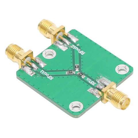 Real Deal Two Way RF Power Splitter Module And Signal Dividing PCB Board Offering Six Decibel Attenuation With Straight Up Reliable DC To Five Gigahertz Operation Period, showing SMA connectors and green PCB.