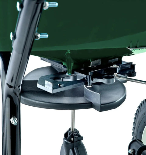 Close-up of dual material plates on Walk-Behind Broadcast Spreader for Fertilizer, Grass Seed and Salt, 80 lb hopper lower frame view.