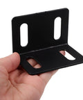 Close-up of handheld Beefy Right Angle Shelf Brackets Set Of 10 Heavy Duty Metal Corner Braces 2.0mm Thick Black Finish
