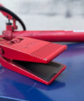 Heavy Duty Half Ton Hydraulic Spreader With Power Jaw Ram Coupler, red jaw open on blue surface, showing jaw design, for industrial use.