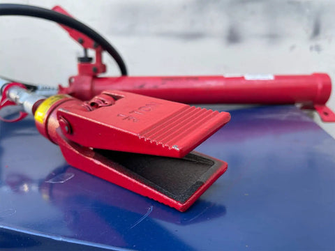 Heavy Duty Half Ton Hydraulic Spreader With Power Jaw Ram Coupler, red jaw open on blue surface, showing jaw design, for industrial use.