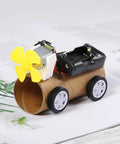 Toy car with a paper roll body, plastic wheels, yellow propeller from Kids DIY DC Motor Kit With 131 Pieces And 66 Gears Six Pack Bundle.