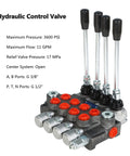 Front view of a four-spool hydraulic control valve with black lever handles and red port plugs