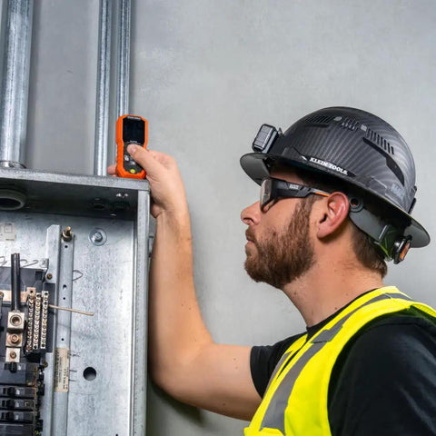 Worker using Green Laser Distance Measure Tool With 200 Foot Range For DIY And Pros, USB Rechargeable, on a job site