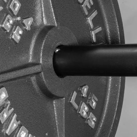 Adapter Sleeve No Frills Converts 1 Inch Standard To 2 Inch Weight Posts fitted on bar with 45lb weight plate