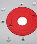 Close-up of Premium Aluminum Alloy Router Table Insert Plate with Center Alignment Bushing for DIY woodworking.