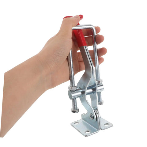 Hand holding Super Heavy Duty Galvanized Iron Toggle Latch Clamps Hold 2183 Lbs With Quick Release Adjustments.