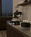 Premium Espresso Coffee Distributor And Tamper Leveler With Adjustable Rotary Depth And Twelve Prongs on kitchen counter.
