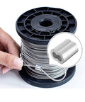 Hand holding wire with 120 Piece Aluminum Crimp Sleeve Set For Three Thirty Second Inch Wire Rope And Cable, ideal for rigging.