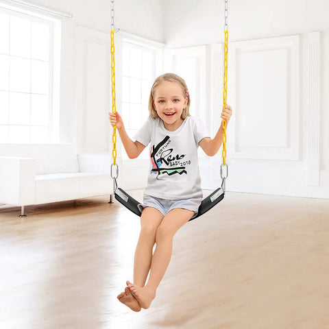 Young girl swinging indoors on the Soft EVA Swing Seat With 66 Inch Anti Rust Chains Thermoplastic Coated Supports Up To 250 Lbs
