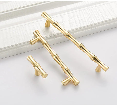 Bamboo Shape Solid Zinc Alloy Cabinet Knobs Set Of 6 In Golden Finish displayed on a white surface, highlighting design and finish.