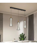 Modern Black Creative Pendant Lamp Pretty Waist LED Light for Duplex Living Room Staircase Loft Restaurant (Colour: 1Light Size: Neutrallight4000K) (3lights Neutrallight4000K) hanging above a table.