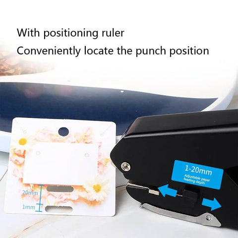 Portable Oval Hole Puncher 1 Inch Hole Size, 10 Sheets Capacity with Positioning Ruler, punching into floral paper.