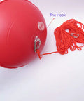 Close-up of Red Dive Flag Inflatable Surface Marker Buoy with rope hook for scuba diving, spearfishing, and boating.