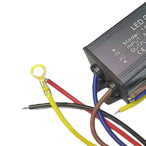 Top Shelf Heavy Duty LED Driver Power Supply For Outdoor Patio And Yard Lighting Runs Slick On Rugged Aluminum Housing With Rock Solid Surge Protection, showing wiring connections and metal casing.