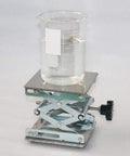 Heavy Duty 4 Inch By 4 Inch Stainless Steel Lab Jack Lift Stand Table Scissor Platform with beaker on top.