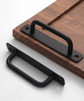 12 Pack Matte Black Cabinet Handles Aluminum Drawer Pulls for Sliding Doors on wooden board, showing installation