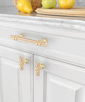 Brushed Brass Cabinet Knobs 10 Pack for Kitchen Cabinets and Dresser Drawers Zinc Hardware installed on white cabinetry