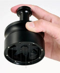 Killer Precision Rotary WDT Tool For Espresso Portafilter, black metal design, held in hand, for even coffee ground distribution.