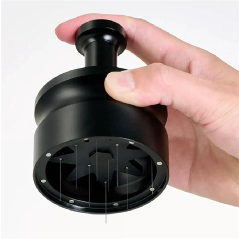 Killer Precision Rotary WDT Tool For Espresso Portafilter, black metal design, held in hand, for even coffee ground distribution.