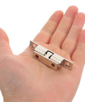 Healeep 10PCS Copper Door Catch With Silent Close Function For Kitchen Cabinets, sturdy snap latch shown in a hand.