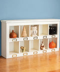 White cubby shelf on tabletop, used with Indexing Dado Jig Kit With 1/2 Inch MDF Base And Clear Indicator Mount Plate for cubbies.