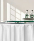 24 Inch Glass Lazy Susan Turntable With 6 Rotating Wheels on dining table with plates and bottles