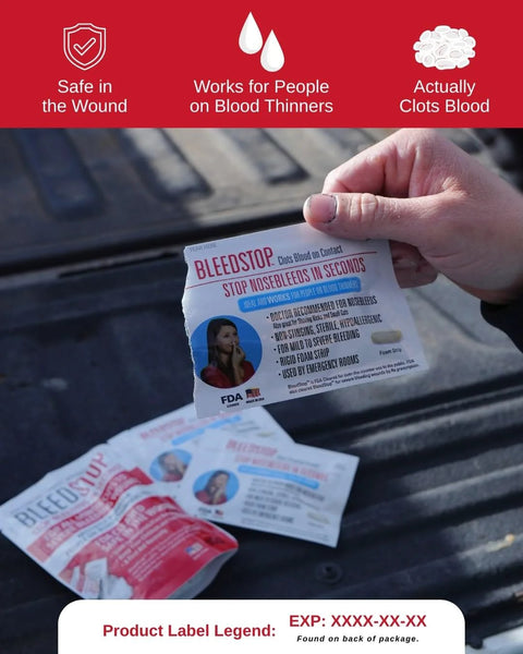 Front view of BleedStop Nosebleed Strips package held in hand; white packaging with red logo and blue text.